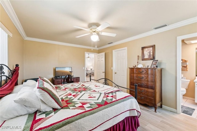914 SW 3rd Ave, Cape Coral, FL 33991 - bedroom with ornamental molding, ensuite bath, a ceiling fan, baseboards, and light wood finished floors