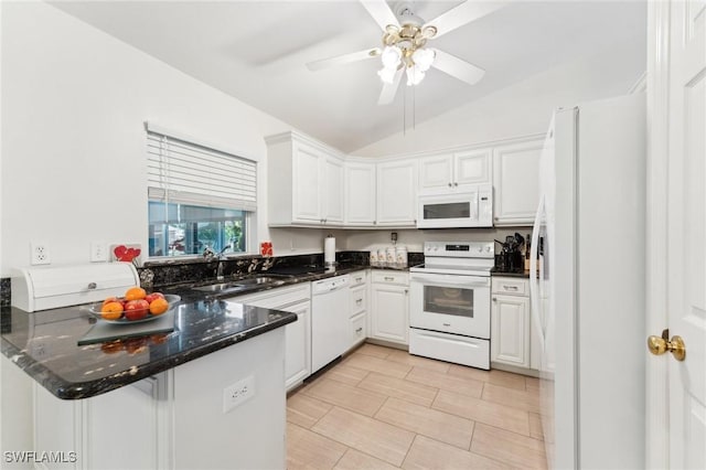 914 SW 3rd Ave, Cape Coral, FL 33991 - kitchen featuring white appliances, a sink, a peninsula, vaulted ceiling, and white cabinetry