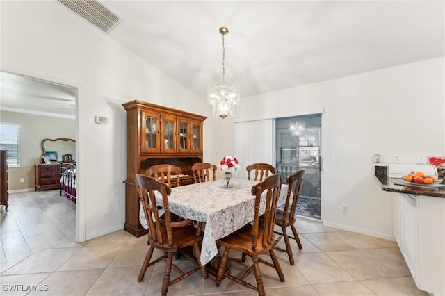 914 SW 3rd Ave, Cape Coral, FL 33991 - dining room with a chandelier, light tile patterned flooring, baseboards, and ornamental molding