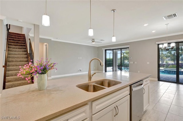 kitchen with stainless steel dishwasher, visible vents, pendant lighting, and a sink