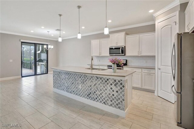 kitchen with backsplash, appliances with stainless steel finishes, a sink, light countertops, and white cabinets