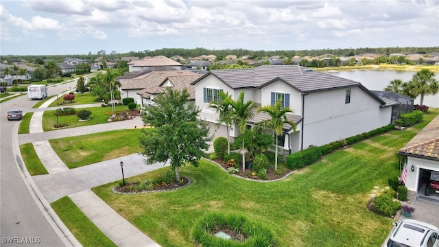 bird's eye view featuring a water view and a residential view