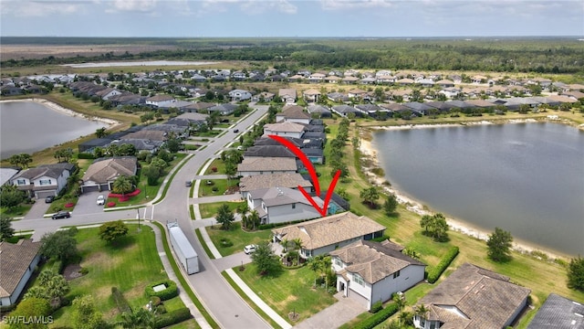 aerial view featuring a water view and a residential view