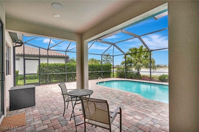 view of pool with a fenced in pool, a lanai, and a patio area