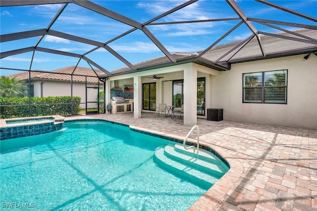 view of swimming pool with a lanai, ceiling fan, a pool with connected hot tub, and a patio area