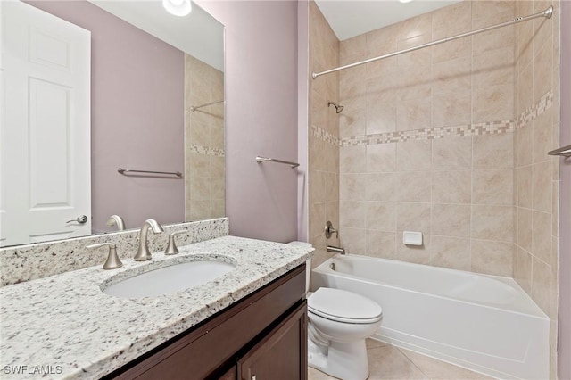 bathroom featuring vanity, tile patterned floors, bathtub / shower combination, and toilet