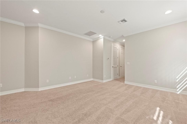 spare room with light colored carpet, recessed lighting, baseboards, visible vents, and ornamental molding