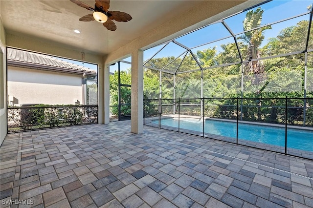 pool with a patio, ceiling fan, and a lanai