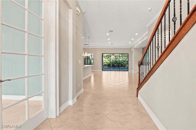 corridor with crown molding, light tile patterned flooring, recessed lighting, baseboards, and stairway