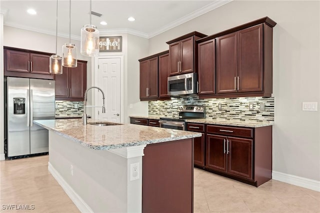 kitchen featuring light stone countertops, appliances with stainless steel finishes, a sink, decorative backsplash, and visible vents