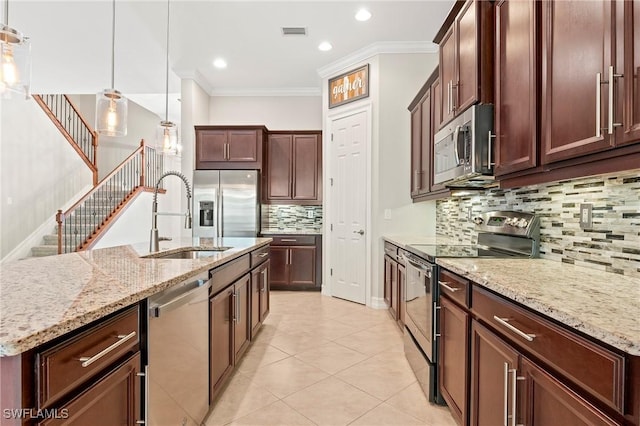kitchen featuring visible vents, tasteful backsplash, a sink, ornamental molding, and stainless steel appliances