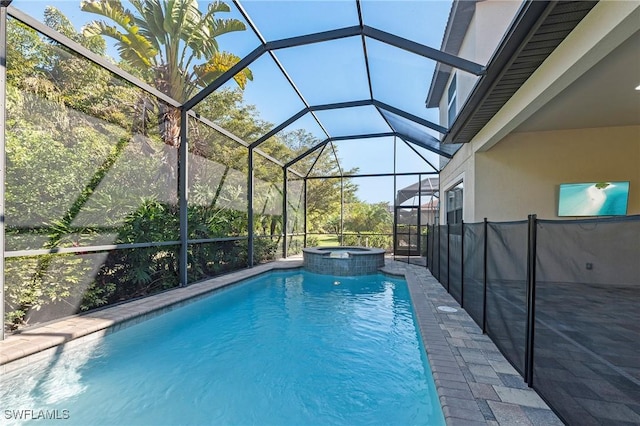 view of swimming pool with a lanai, a patio, and a pool with connected hot tub