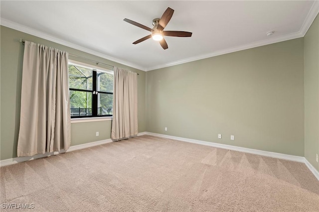 unfurnished room with baseboards, a ceiling fan, light carpet, and ornamental molding