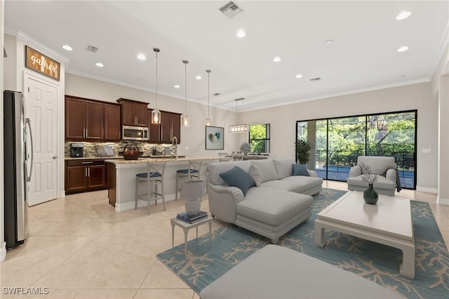 14351 Tuscany Pointe Trl, Naples, FL 34120 - living area featuring visible vents, light tile patterned flooring, ornamental molding, and recessed lighting
