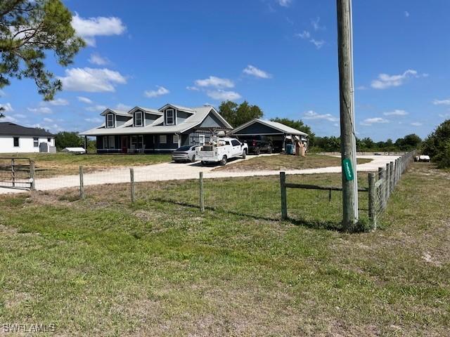 7834 15th Pl, Labelle, FL 33935 - view of yard featuring fence and driveway