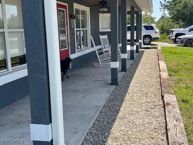 7834 15th Pl, Labelle, FL 33935 - view of patio / terrace with a porch and ceiling fan