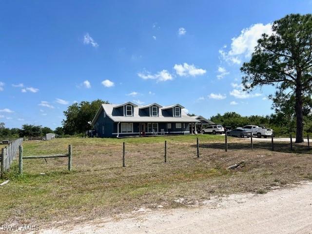 7834 15th Pl, Labelle, FL 33935 - view of front of house with fence