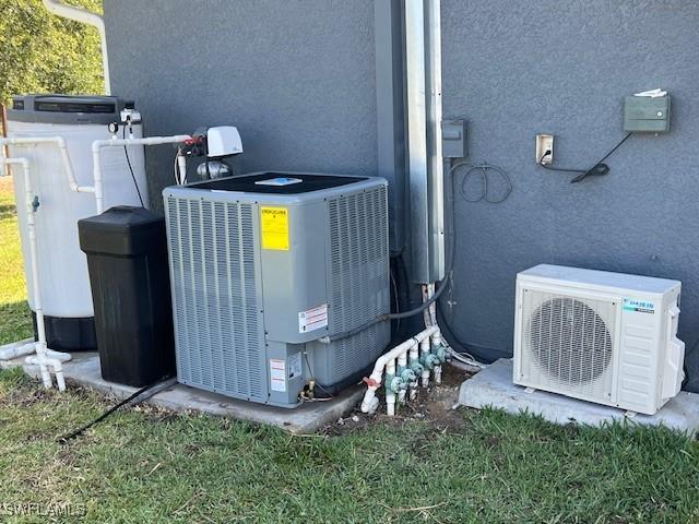 7834 15th Pl, Labelle, FL 33935 - details featuring central AC unit, ac unit, and stucco siding