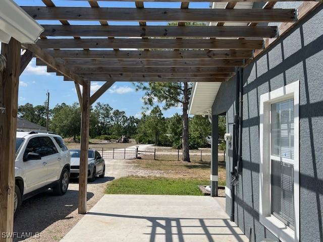 7834 15th Pl, Labelle, FL 33935 - view of patio featuring a pergola