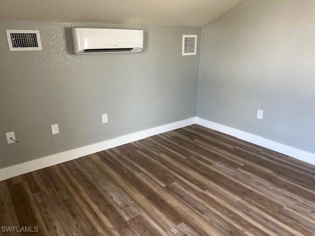 7834 15th Pl, Labelle, FL 33935 - spare room with baseboards, a wall unit AC, and visible vents