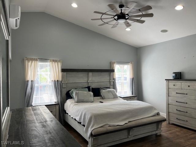 7834 15th Pl, Labelle, FL 33935 - bedroom featuring dark wood-style flooring, recessed lighting, vaulted ceiling, and multiple windows