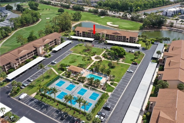 birds eye view of property featuring a water view and golf course view