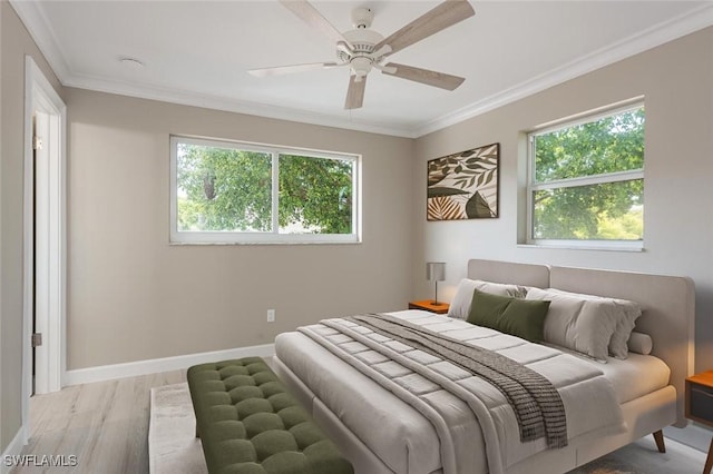 780 10th Ave S Unit 23, Naples, FL 34102 - bedroom featuring crown molding, baseboards, multiple windows, and light wood-style floors