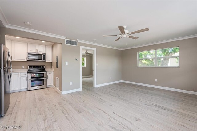 780 10th Ave S Unit 23, Naples, FL 34102 - kitchen with crown molding, appliances with stainless steel finishes, light countertops, a ceiling fan, and visible vents