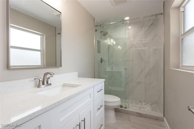 780 10th Ave S Unit 23, Naples, FL 34102 - full bath with a marble finish shower, toilet, and a wealth of natural light