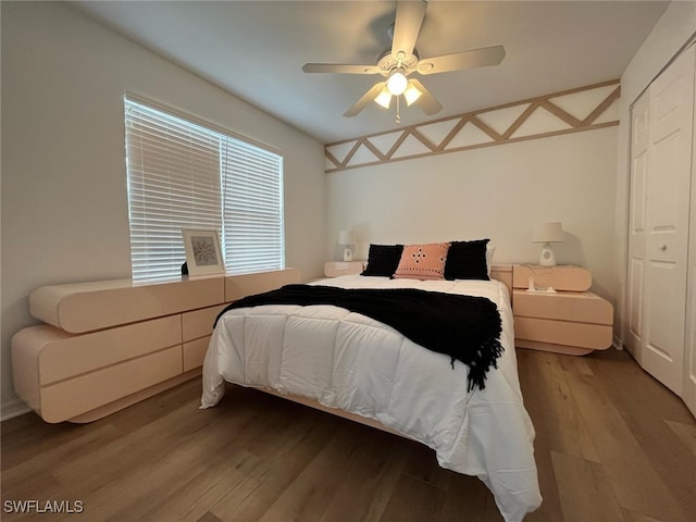 bedroom featuring a ceiling fan and wood finished floors