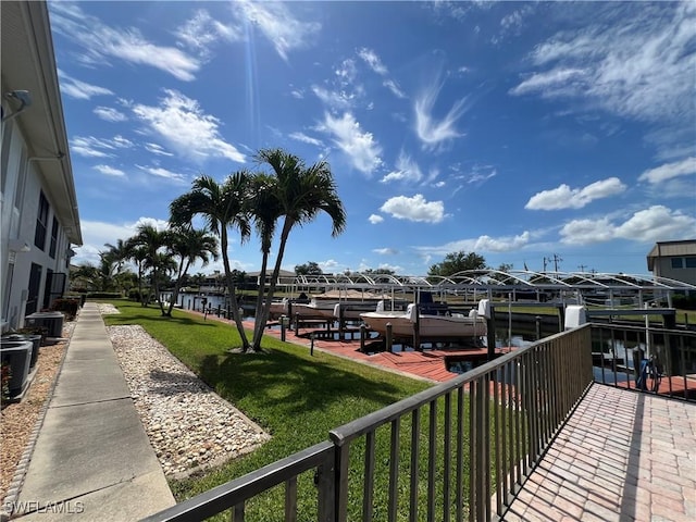 1016 SE 46th St Unit 102, Cape Coral, FL 33904 - balcony featuring a boat dock, central air condition unit, and boat lift
