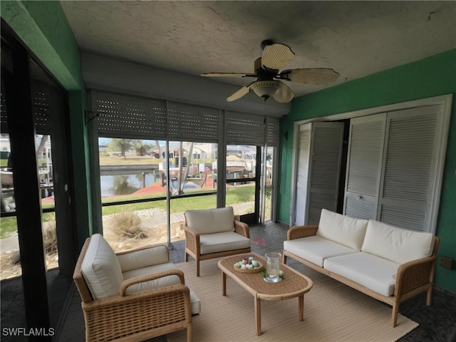 1016 SE 46th St Unit 102, Cape Coral, FL 33904 - sunroom / solarium with a ceiling fan, a water view, and an outdoor living space