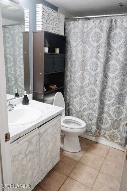 6053 Timberwood Cir Unit 233, Fort Myers, FL 33908 - bathroom featuring tile patterned flooring, a shower with shower curtain, toilet, and vanity