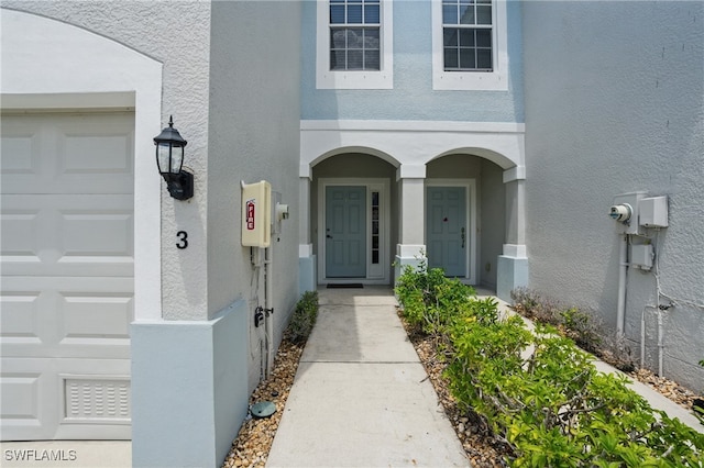 8310 Village Edge Cir Unit 3, Fort Myers, FL 33919 - property entrance featuring stucco siding and an attached garage