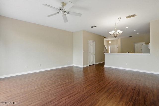 8310 Village Edge Cir Unit 3, Fort Myers, FL 33919 - unfurnished living room featuring visible vents, baseboards, ceiling fan with notable chandelier, and dark wood-style floors