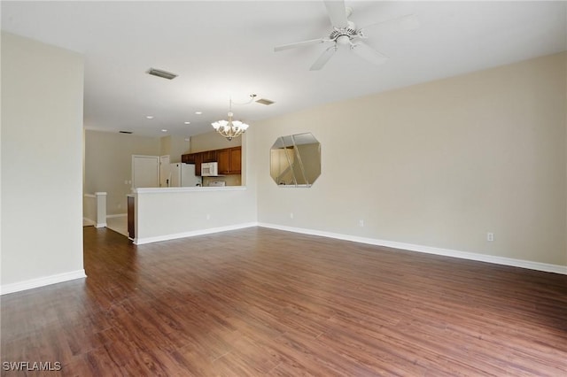 8310 Village Edge Cir Unit 3, Fort Myers, FL 33919 - unfurnished living room featuring visible vents, dark wood finished floors, ceiling fan with notable chandelier, and baseboards