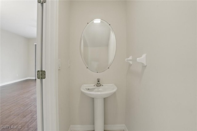8310 Village Edge Cir Unit 3, Fort Myers, FL 33919 - bathroom featuring baseboards and wood finished floors
