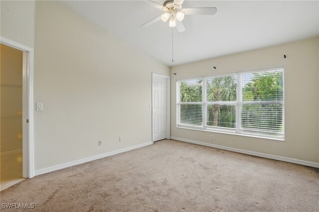 8310 Village Edge Cir Unit 3, Fort Myers, FL 33919 - empty room with carpet floors, a ceiling fan, baseboards, and vaulted ceiling