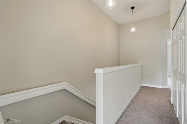 8310 Village Edge Cir Unit 3, Fort Myers, FL 33919 - hallway with carpet floors, baseboards, and an upstairs landing
