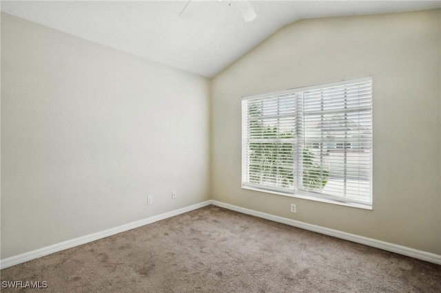 8310 Village Edge Cir Unit 3, Fort Myers, FL 33919 - empty room featuring a ceiling fan, baseboards, vaulted ceiling, and carpet