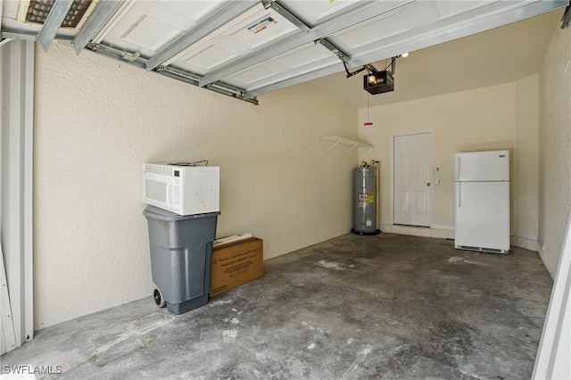8310 Village Edge Cir Unit 3, Fort Myers, FL 33919 - garage featuring freestanding refrigerator, a garage door opener, and water heater