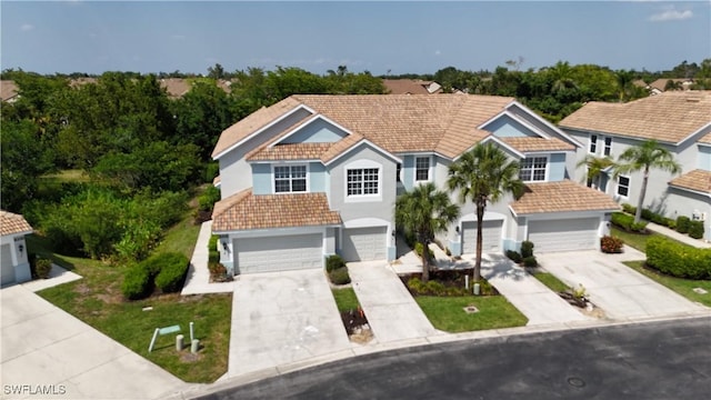 8310 Village Edge Cir Unit 3, Fort Myers, FL 33919 - traditional-style home with an attached garage, stucco siding, and driveway
