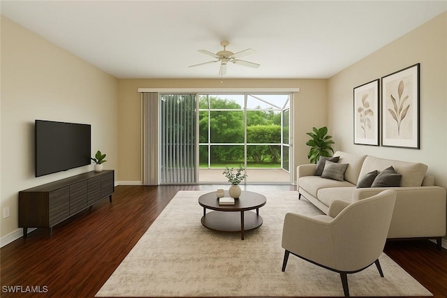 8310 Village Edge Cir Unit 3, Fort Myers, FL 33919 - living area with baseboards, a ceiling fan, and dark wood finished floors