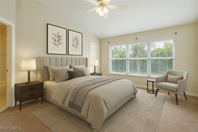 8310 Village Edge Cir Unit 3, Fort Myers, FL 33919 - bedroom featuring light colored carpet, a ceiling fan, baseboards, and vaulted ceiling