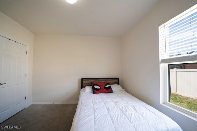 carpeted bedroom with baseboards