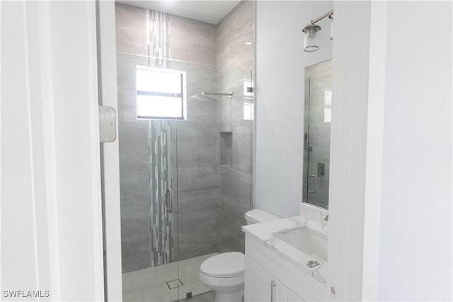 224 Preston St, Lehigh Acres, FL 33974 - bathroom featuring a shower stall, toilet, and vanity