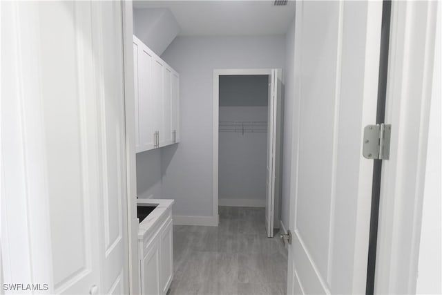 224 Preston St, Lehigh Acres, FL 33974 - washroom with baseboards and light wood-style floors