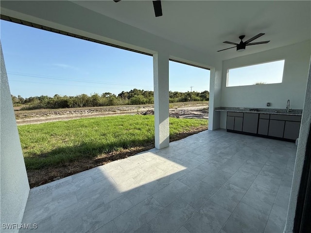 224 Preston St, Lehigh Acres, FL 33974 - view of patio / terrace with ceiling fan, an outdoor kitchen, and a sink