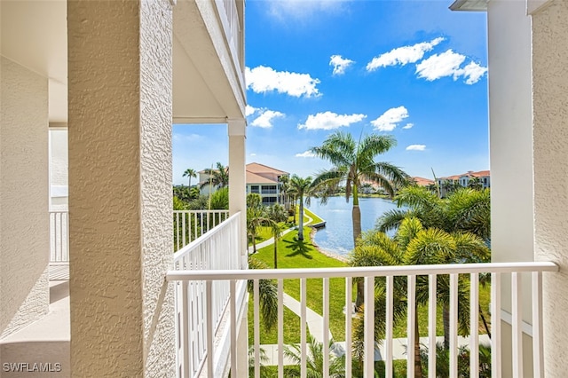balcony featuring a water view