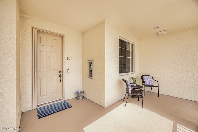 view of exterior entry featuring stucco siding